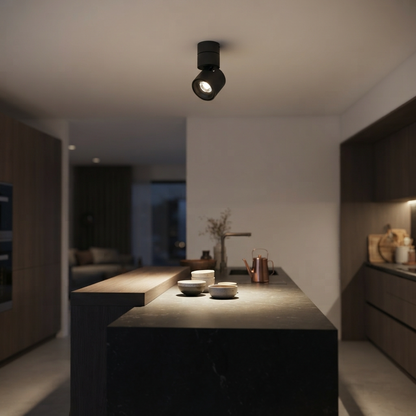 Aura Spotlight 12B021-1 mounted above a modern kitchen island